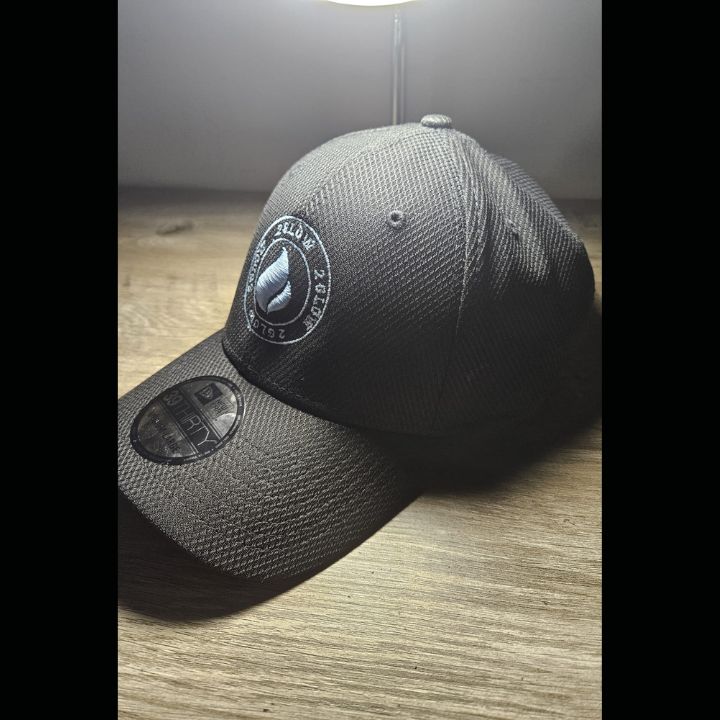Custom Glow in the Dark All Black Flex fit Cap Blue Logo addition with Glow in the Dark Flower on the back of Cap